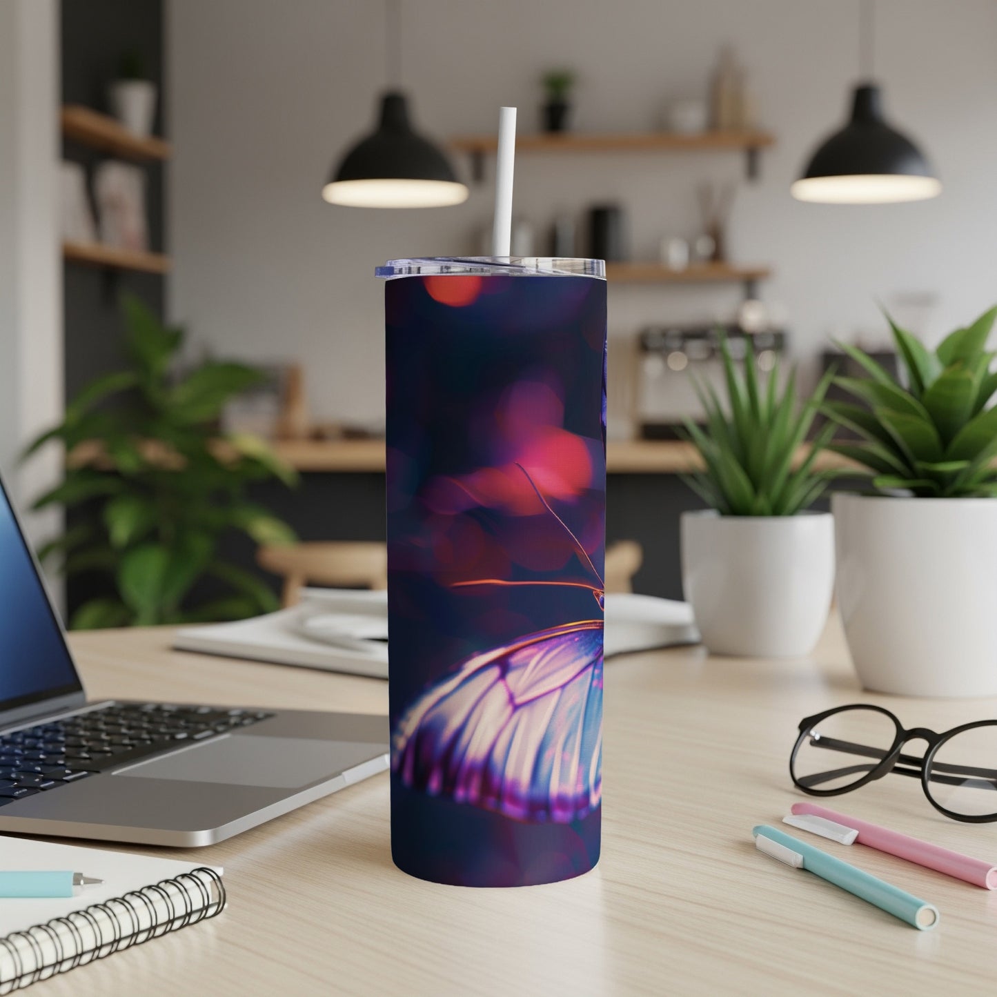 Purple butterfly on a dark, bokeh background, featured on a travel tumbler.