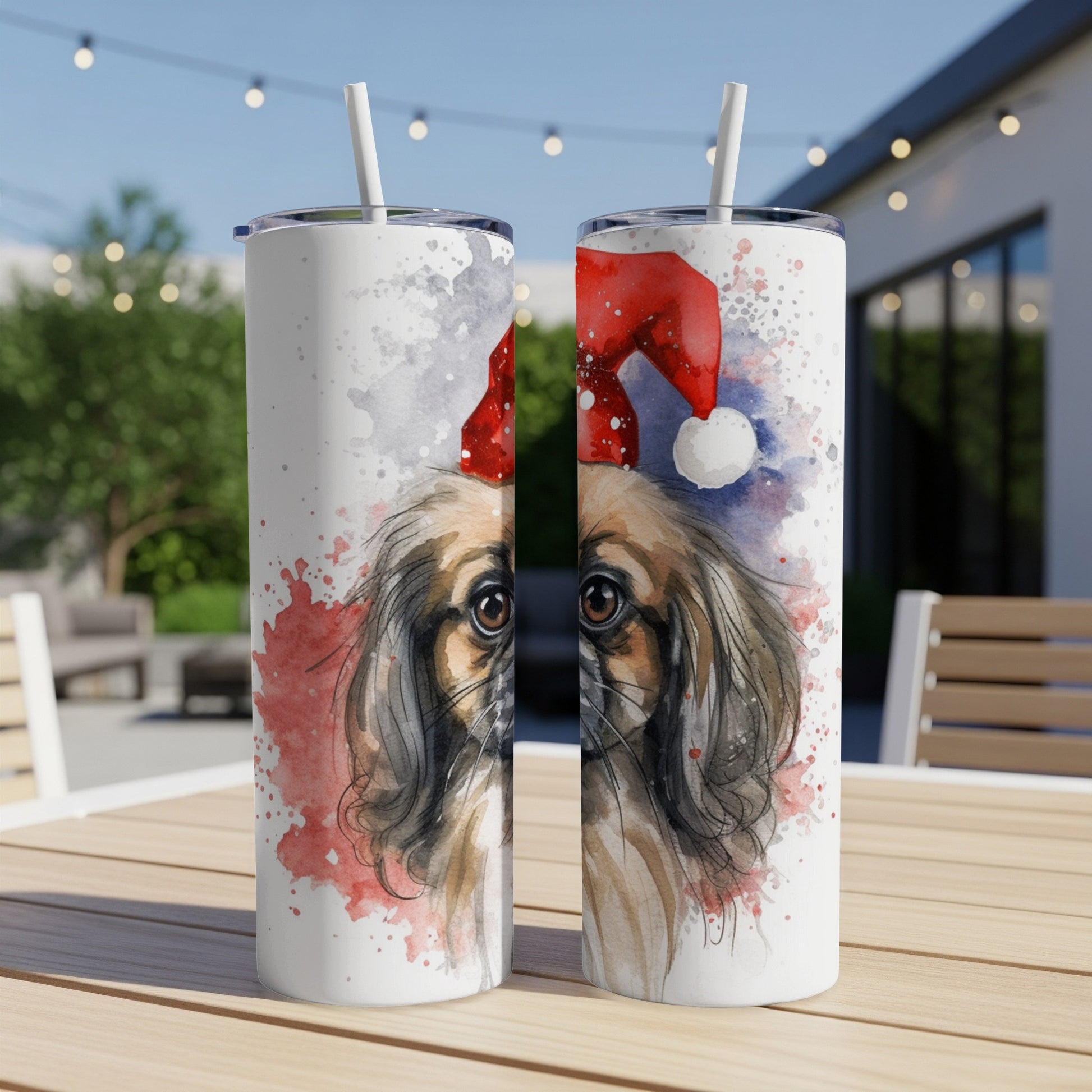 Two tumblers with watercolor painting of a Pekingese dog in a Santa hat.