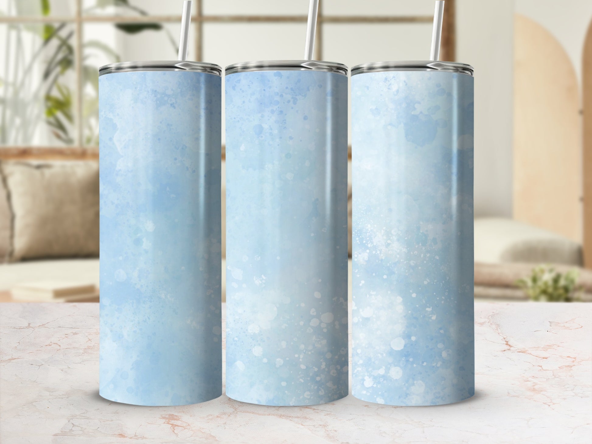 Three light blue watercolor tumblers with white speckles.