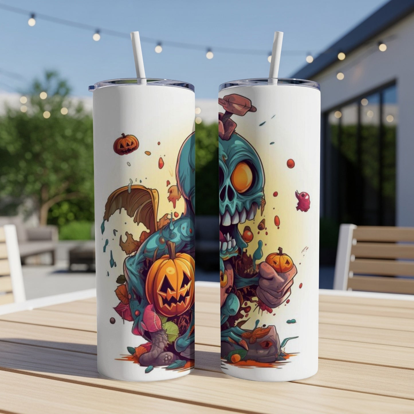 Two tumblers with a cartoon monster and jack-o'-lantern Halloween design.