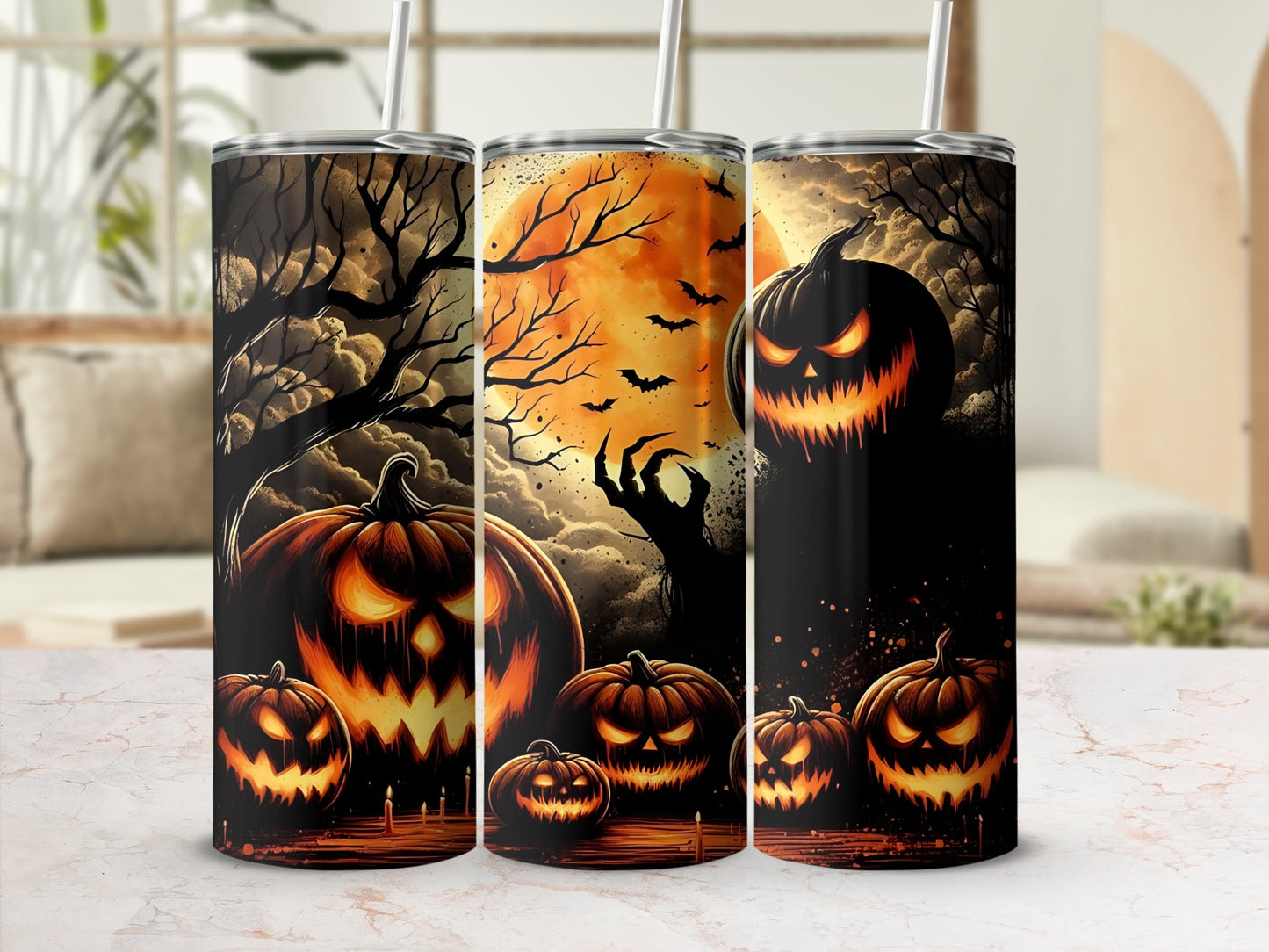 Three tumblers with Halloween designs featuring jack-o'-lanterns, spooky trees, and a full moon.