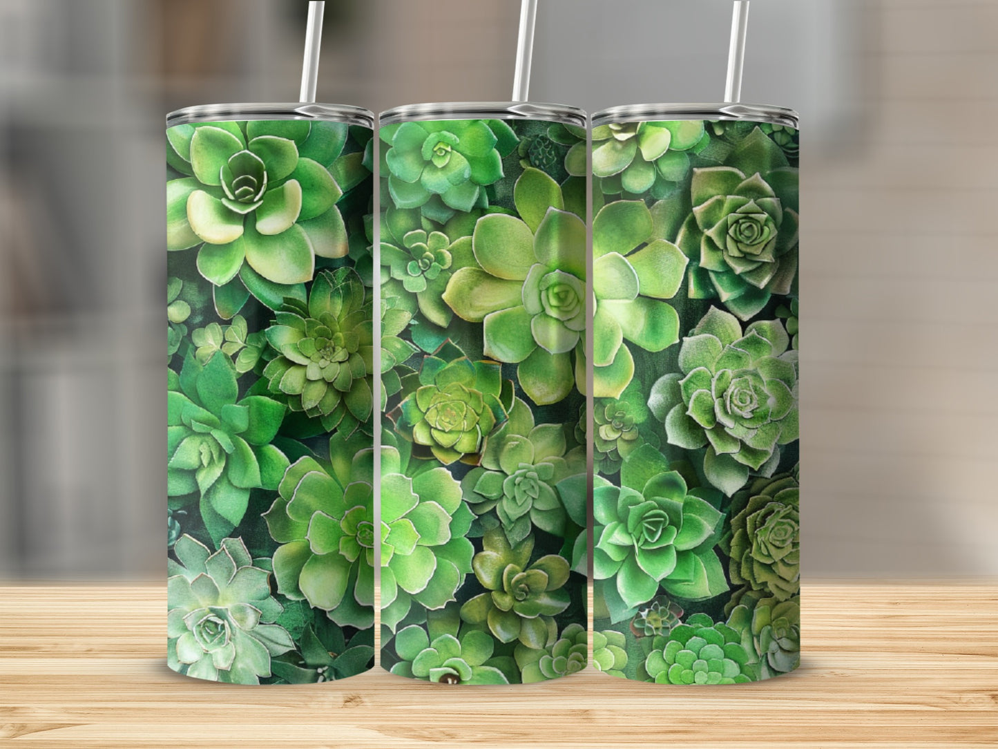 Green succulents arranged in a repeating pattern on three tall tumblers.