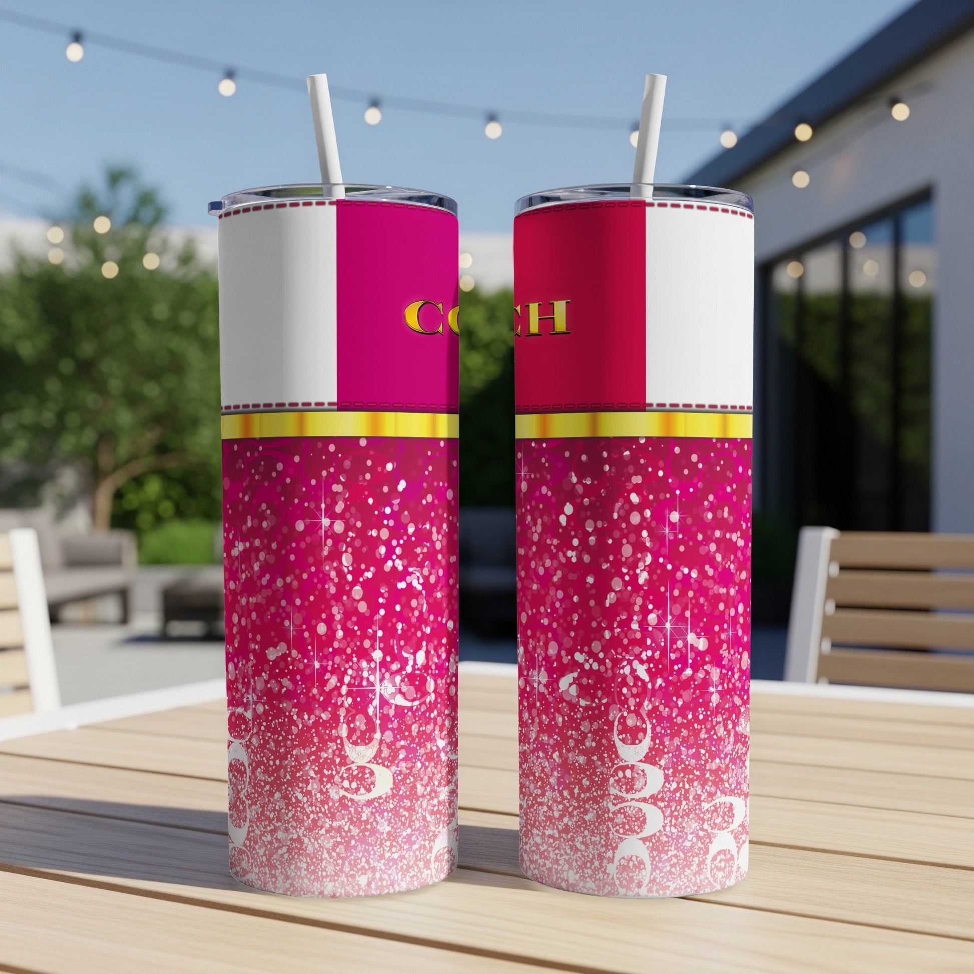 Two skinny tumblers with pink, white, and gold design featuring the word "Coach".