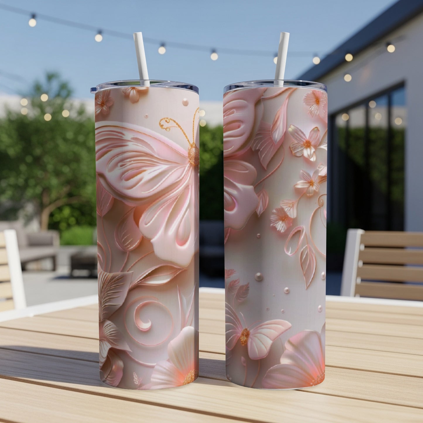 Two tall, narrow tumblers with embossed butterfly and floral designs in pink and peach tones.