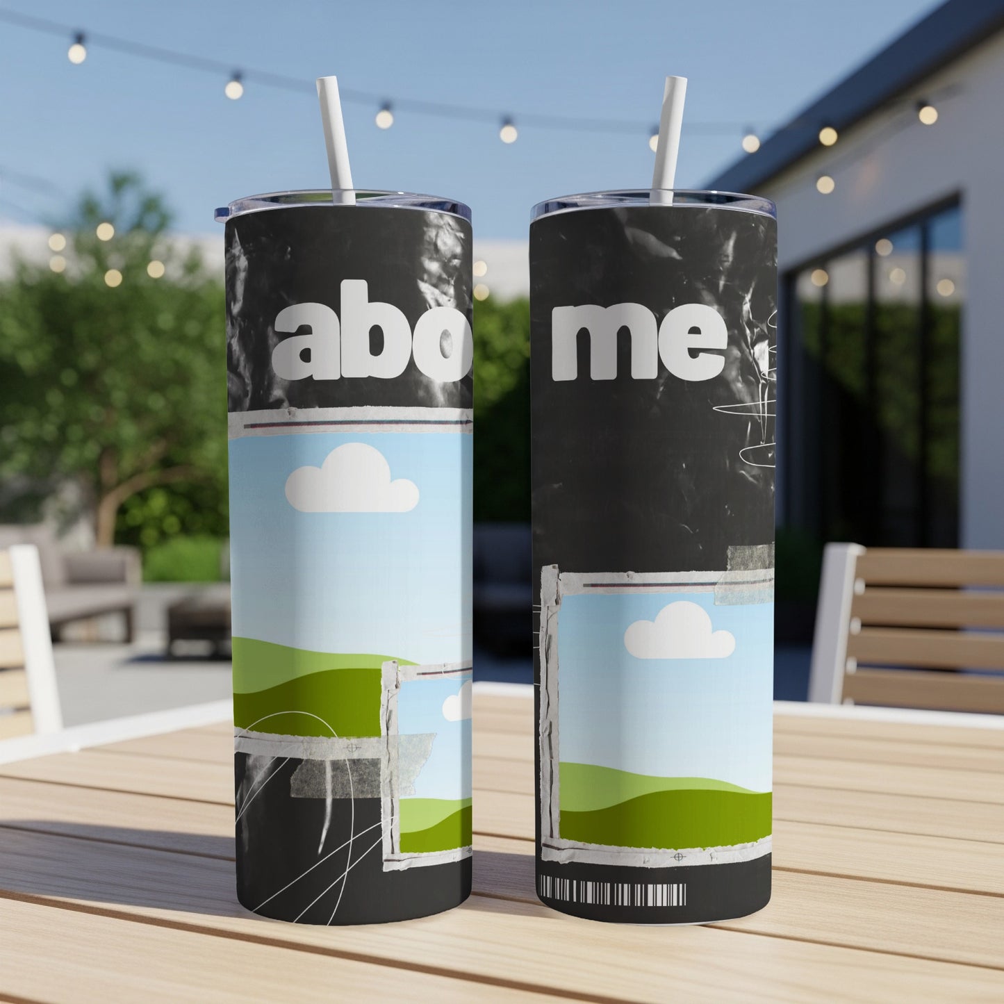 Two tumblers with "abo me" text and landscape graphics, on a table.