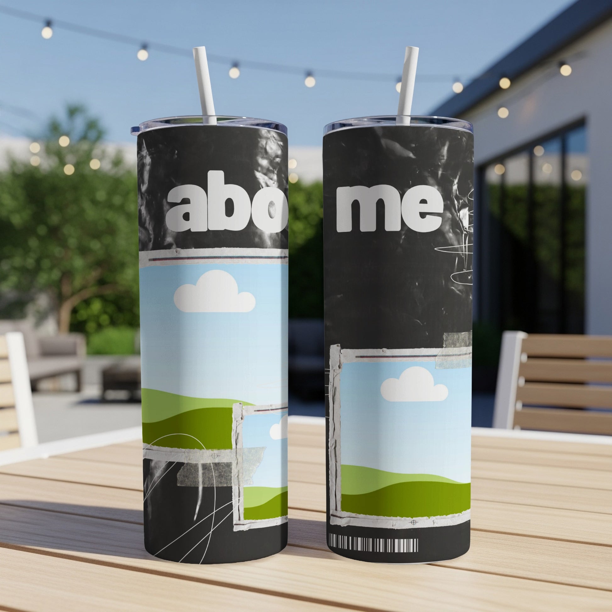 Two tumblers with "abo me" text and landscape graphics, on a table.