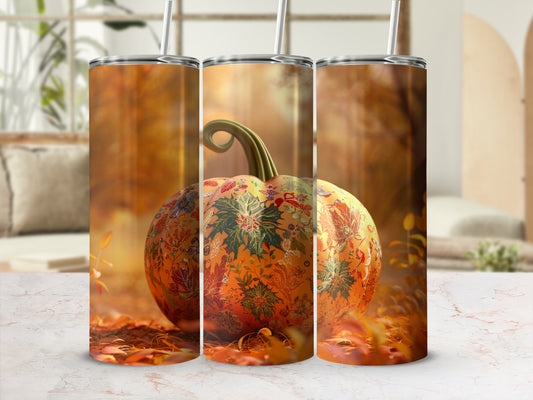 Pumpkin tumbler with floral design on autumn leaves background.