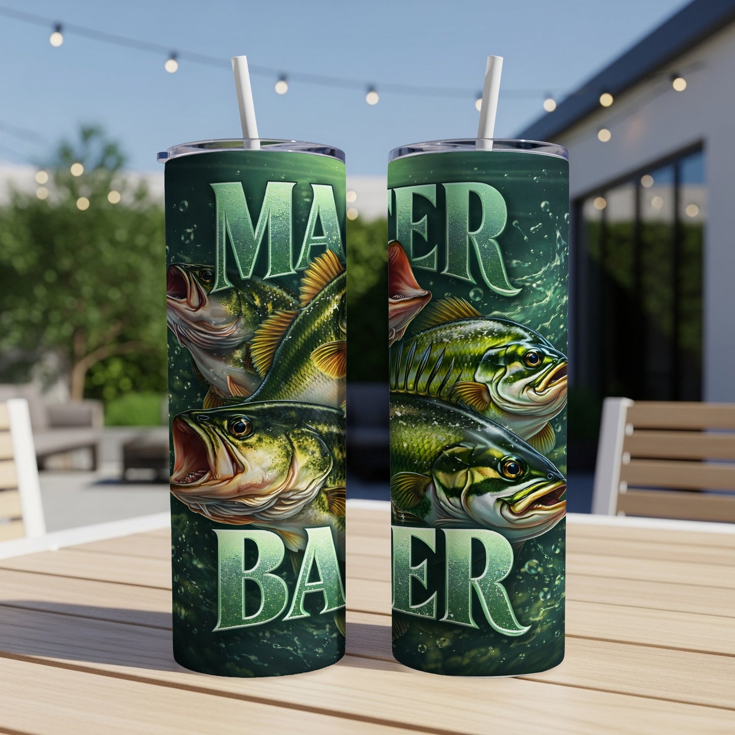Two tumblers with bass fish art and "MAKER" text on a table.
