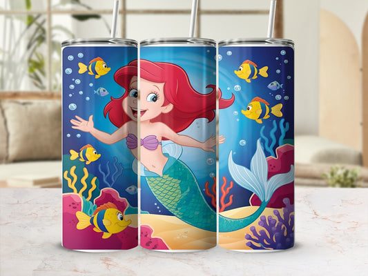 Ariel the mermaid swims underwater with fish and coral.