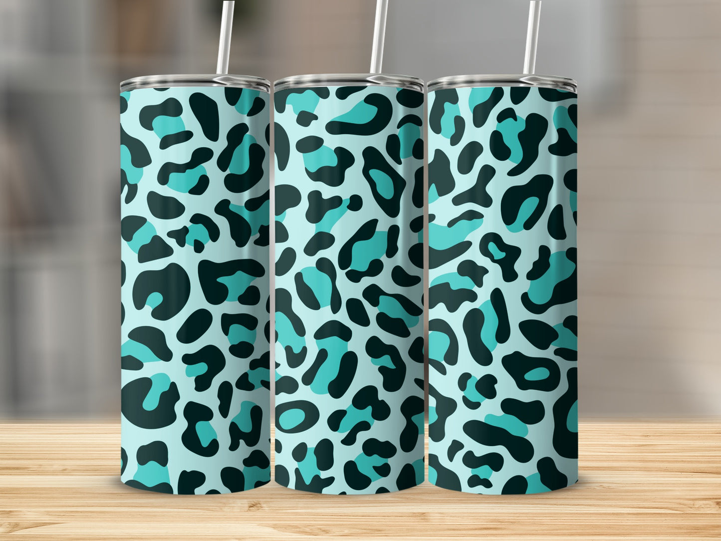 Three tumblers with a teal and black leopard print pattern.