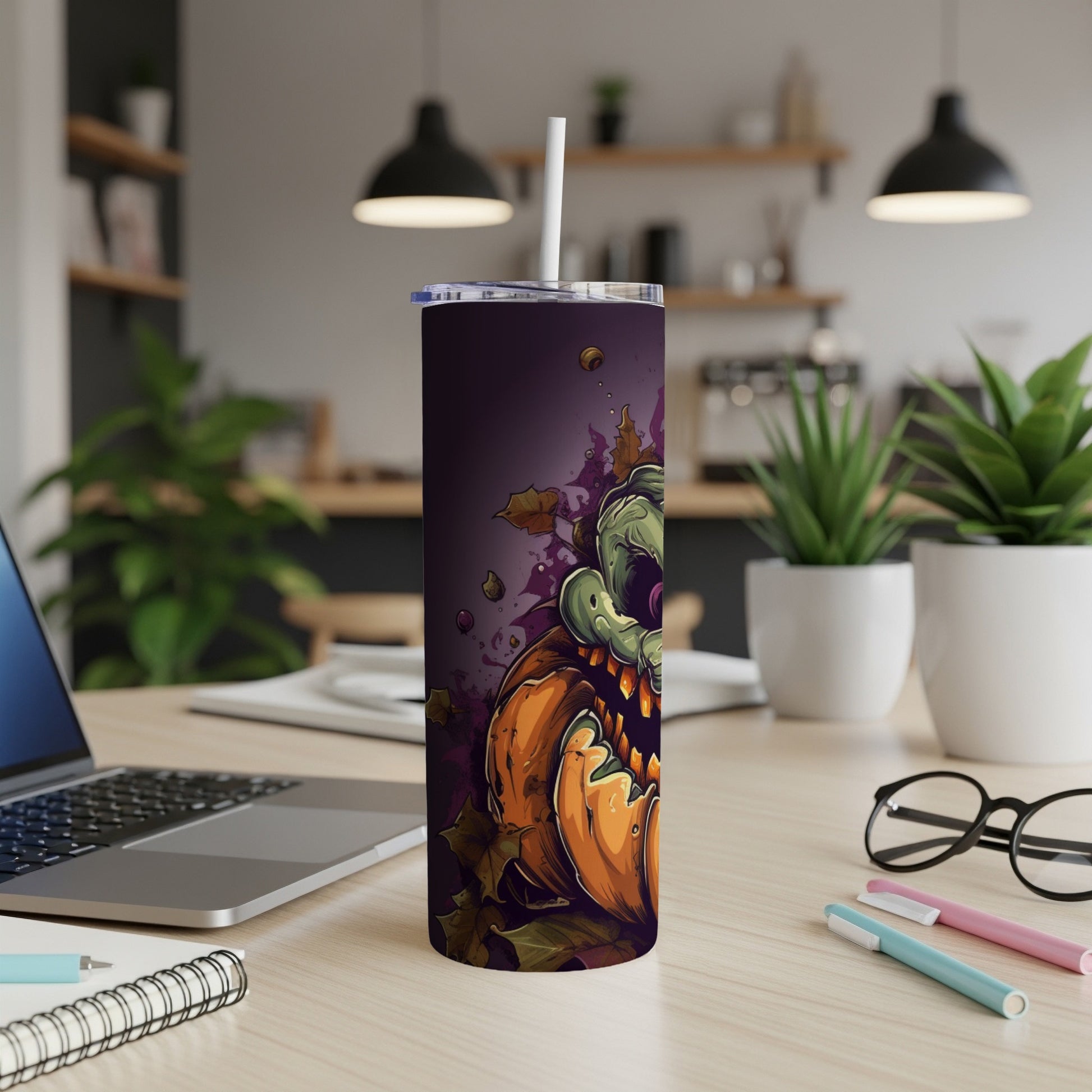 Halloween tumbler with a scary zombie pumpkin design and falling leaves.