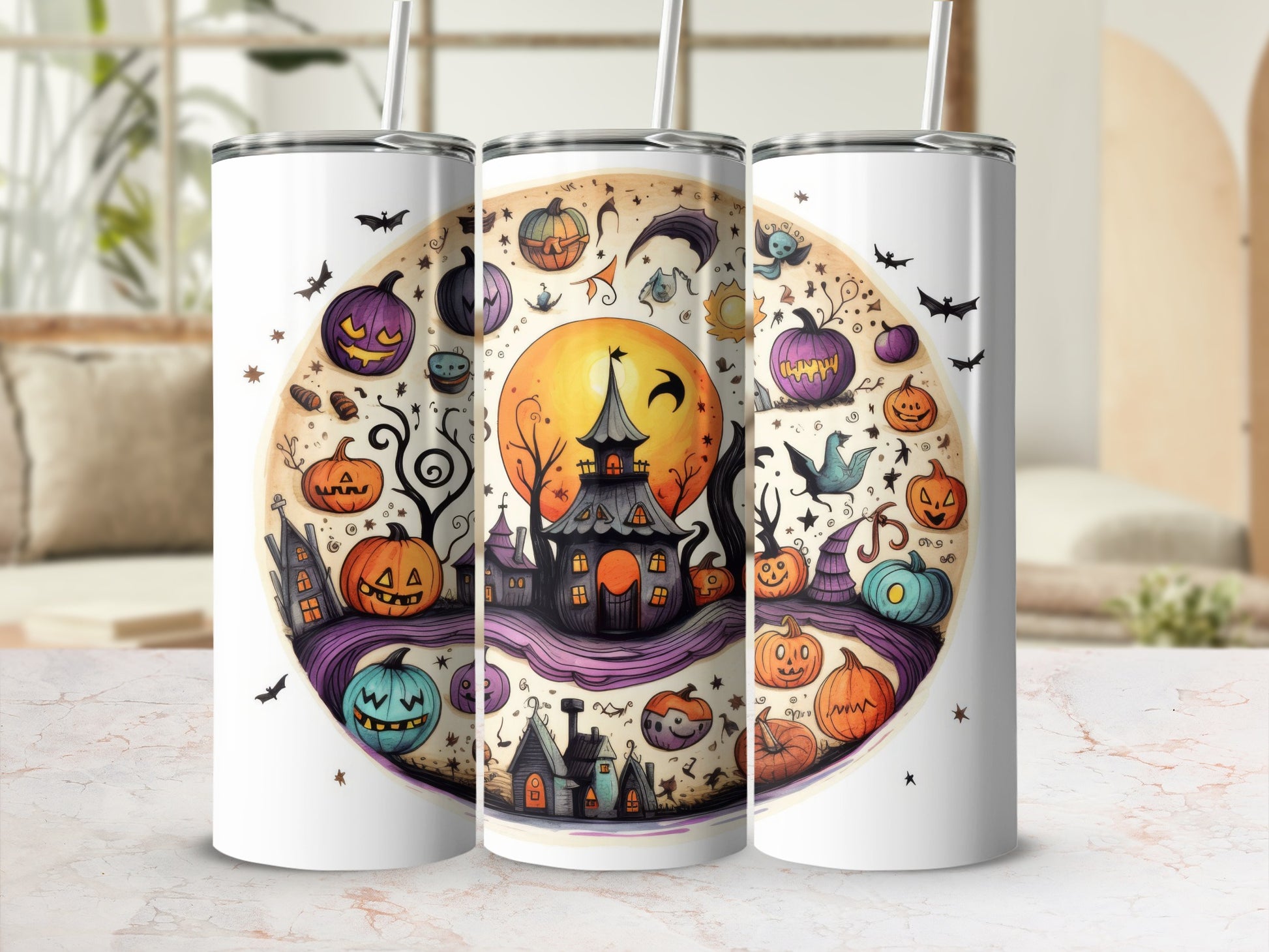 Three tumblers with a watercolor Halloween design of pumpkins, haunted houses, and bats.