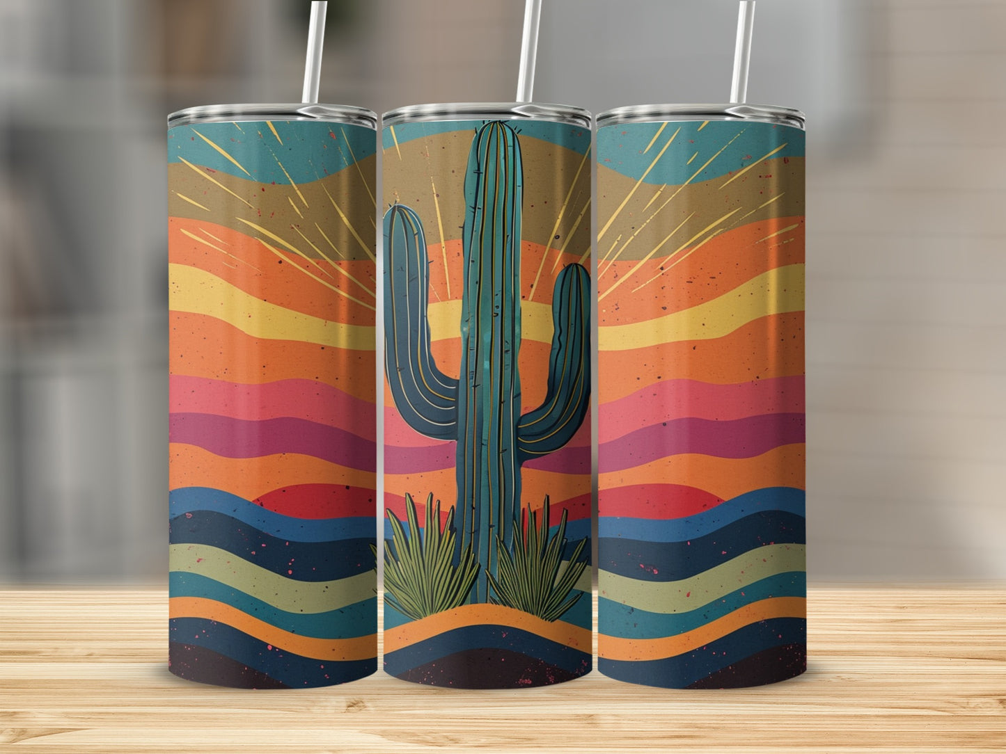Three tumblers featuring a desert sunset with a saguaro cactus design.