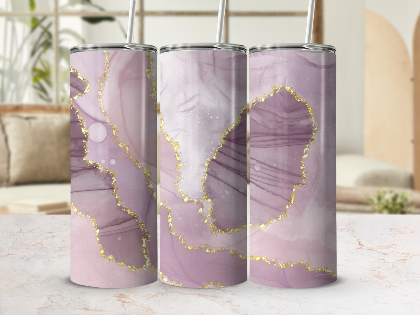 Three tumblers with pink and purple marble design and gold accents.