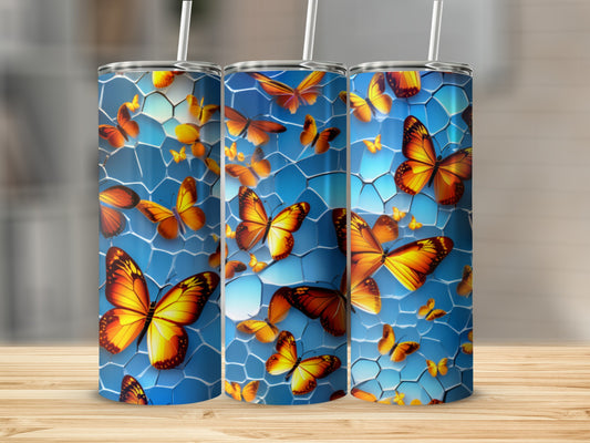 Blue tumbler with vibrant orange butterflies and honeycomb pattern.