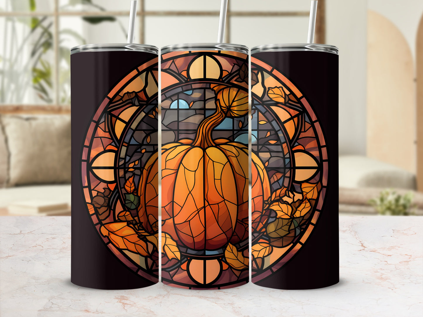 Pumpkin stained glass art on three tumblers with straws.