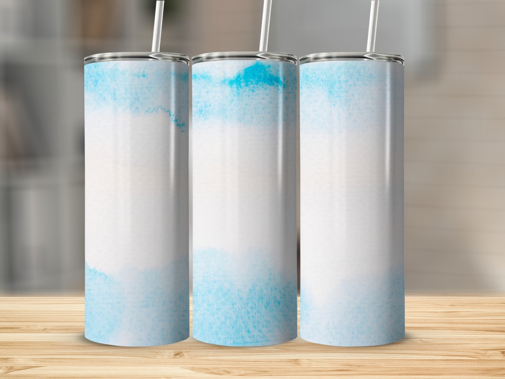 Three blank tumblers with a watercolor blue and white design.