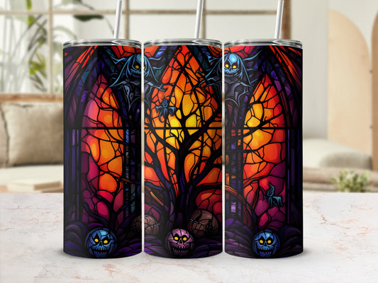 Stained glass tumbler with spooky Halloween design and pumpkins.