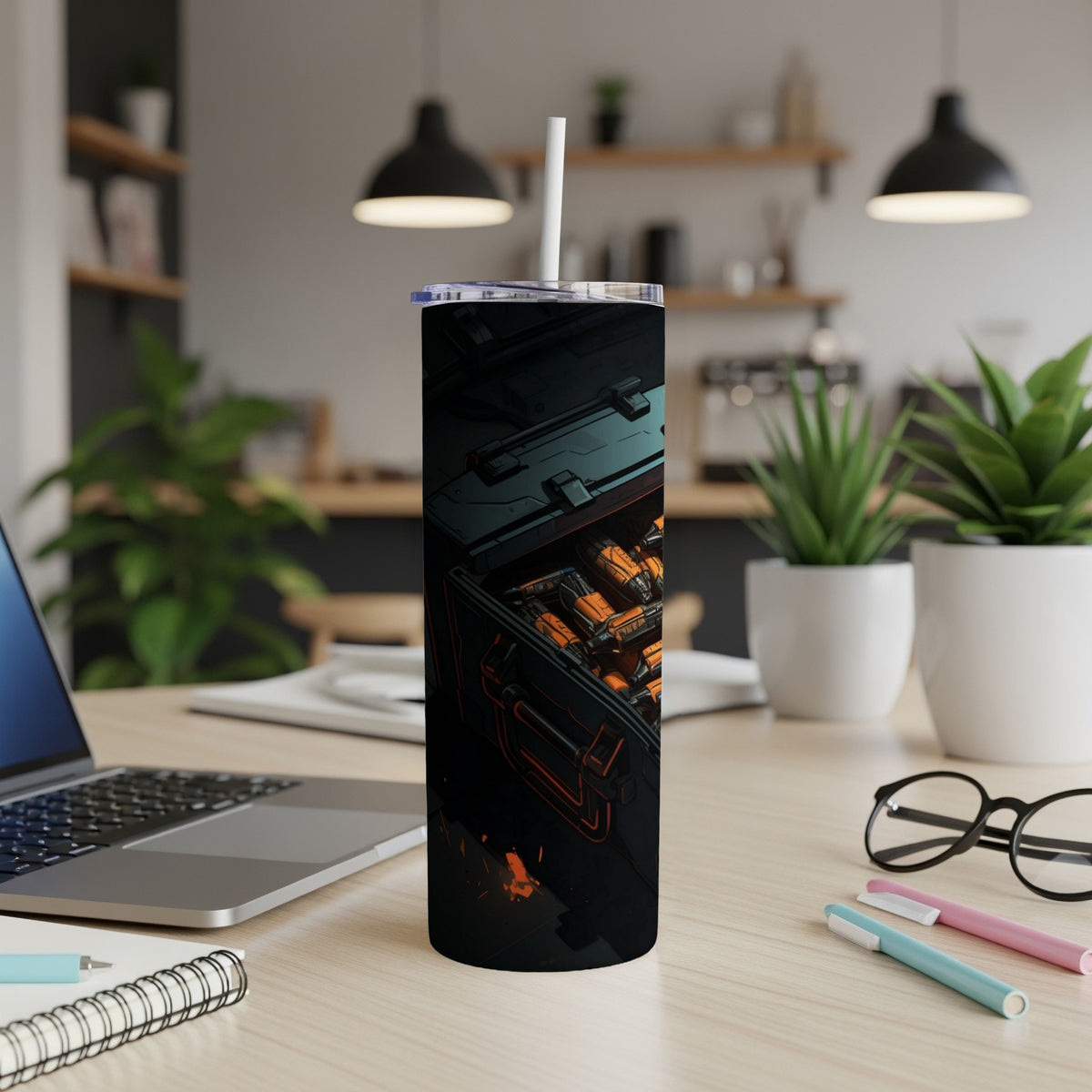 Tumbler with a dark, futuristic design of orange components inside a dark case.