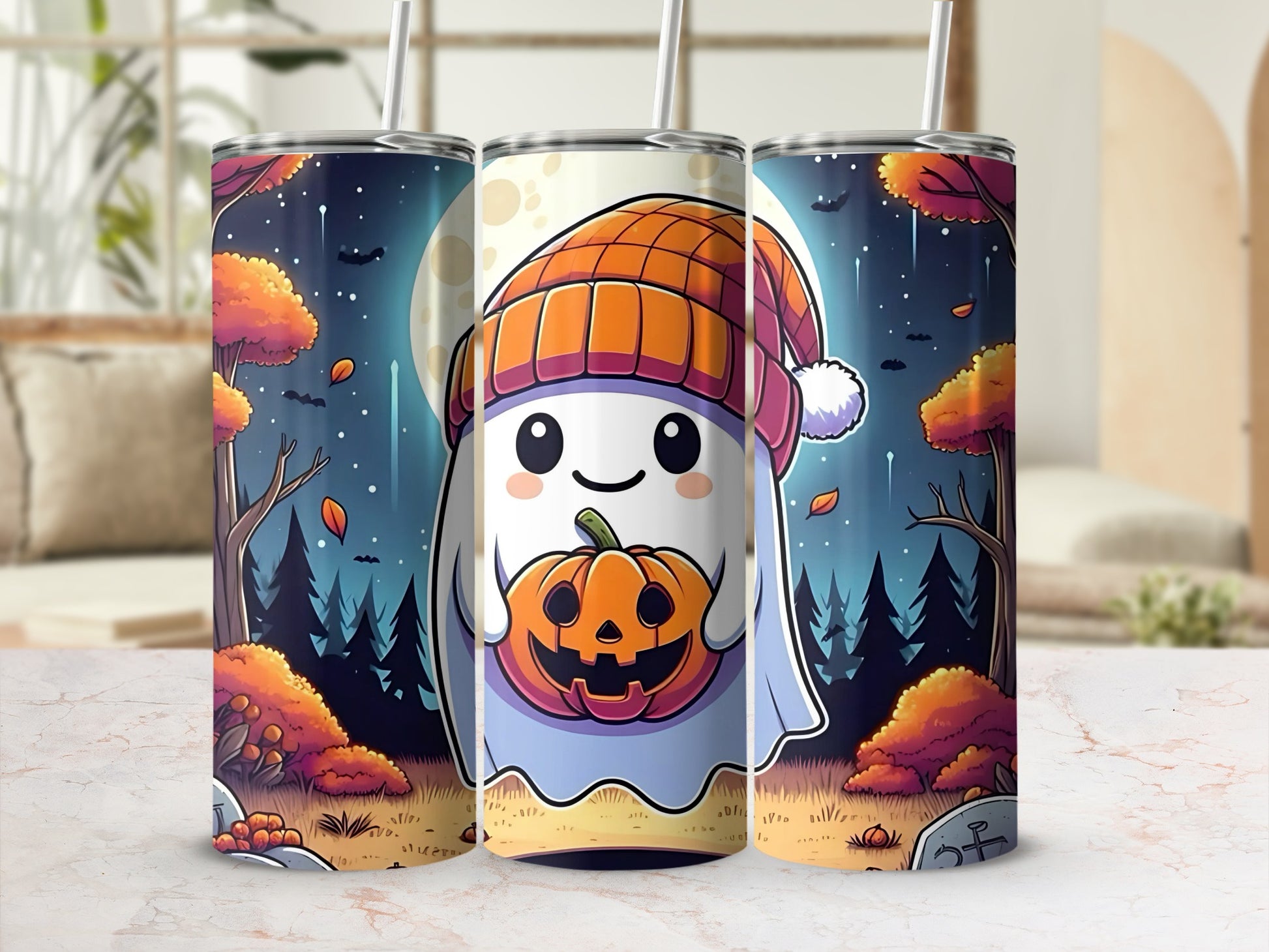 Three tumblers with a cute ghost character holding a jack-o-lantern.