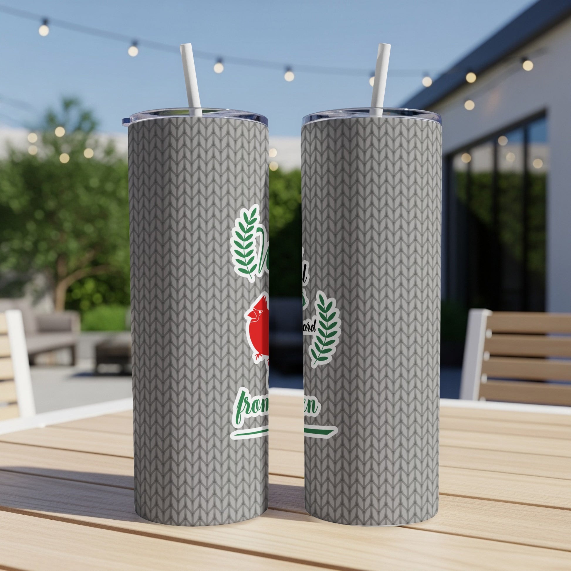Gray knitted pattern tumbler with a red cardinal and green wreath design.