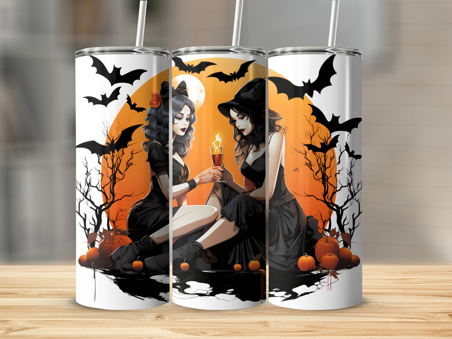 Halloween tumblers with two witches holding a candle in front of a full moon and bats.