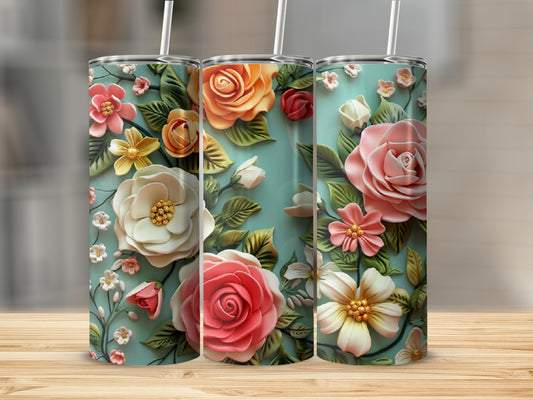 Three tumblers with raised floral designs, including roses and daisies, on a teal background.