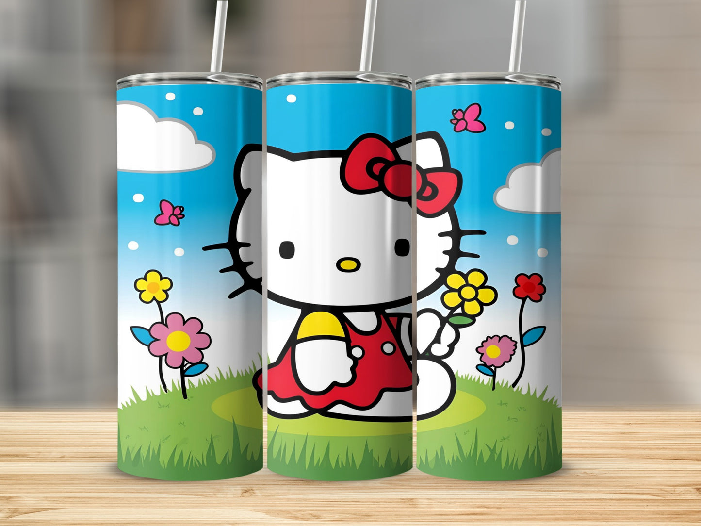 Hello Kitty tumbler with grass, flowers, and butterflies.