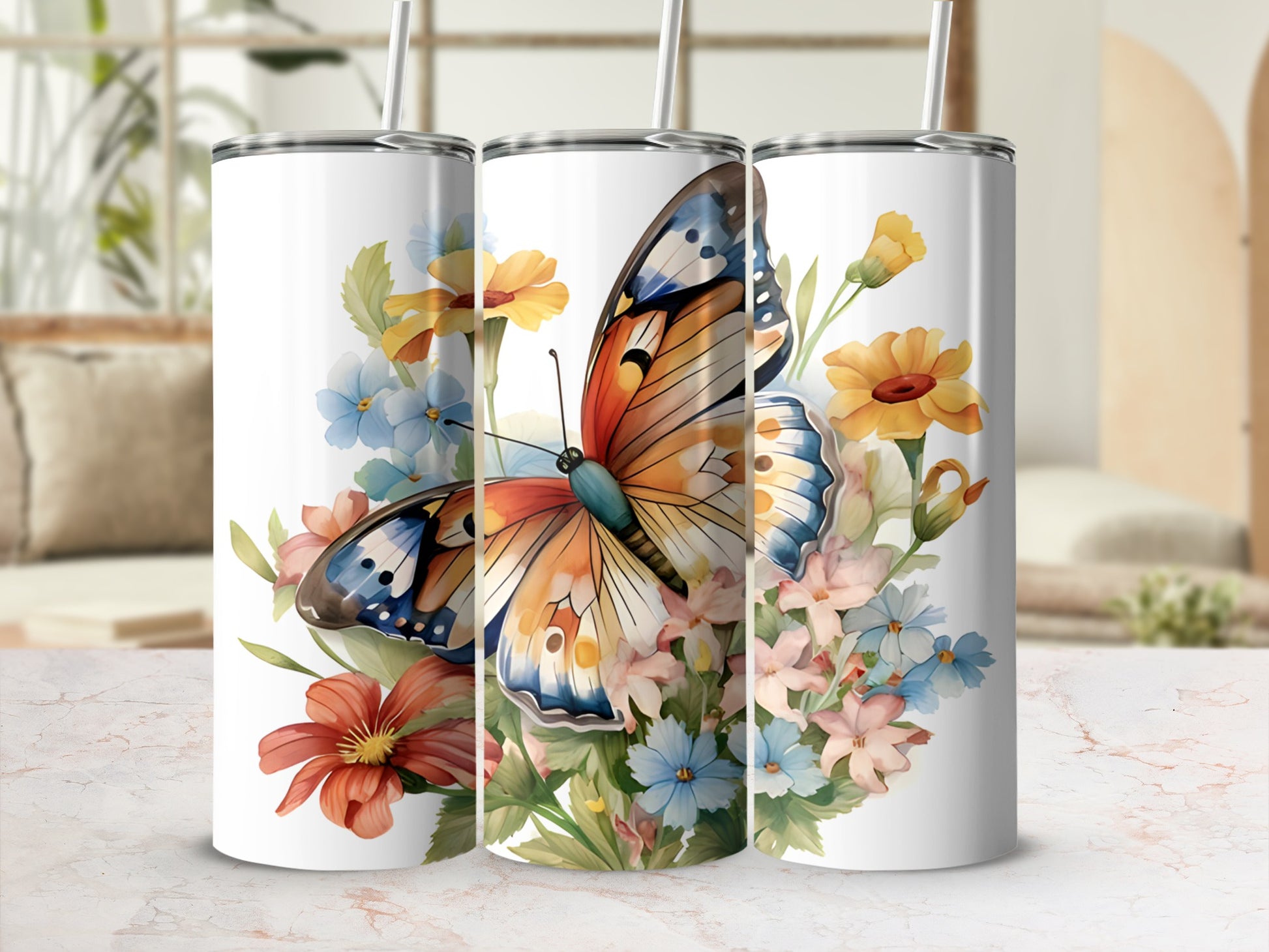 Three tumblers featuring a colorful butterfly and floral design.