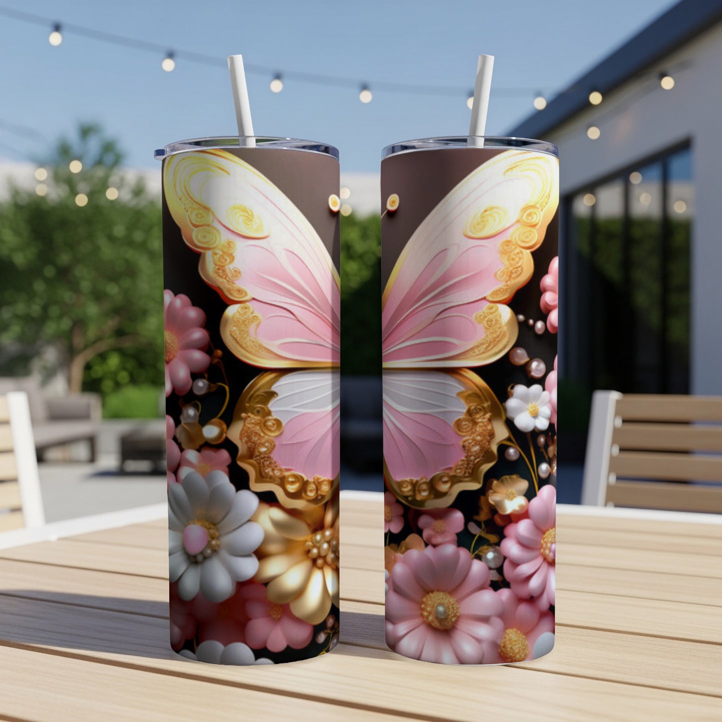 Two tumblers with pink butterfly wings and floral designs on a wooden table.