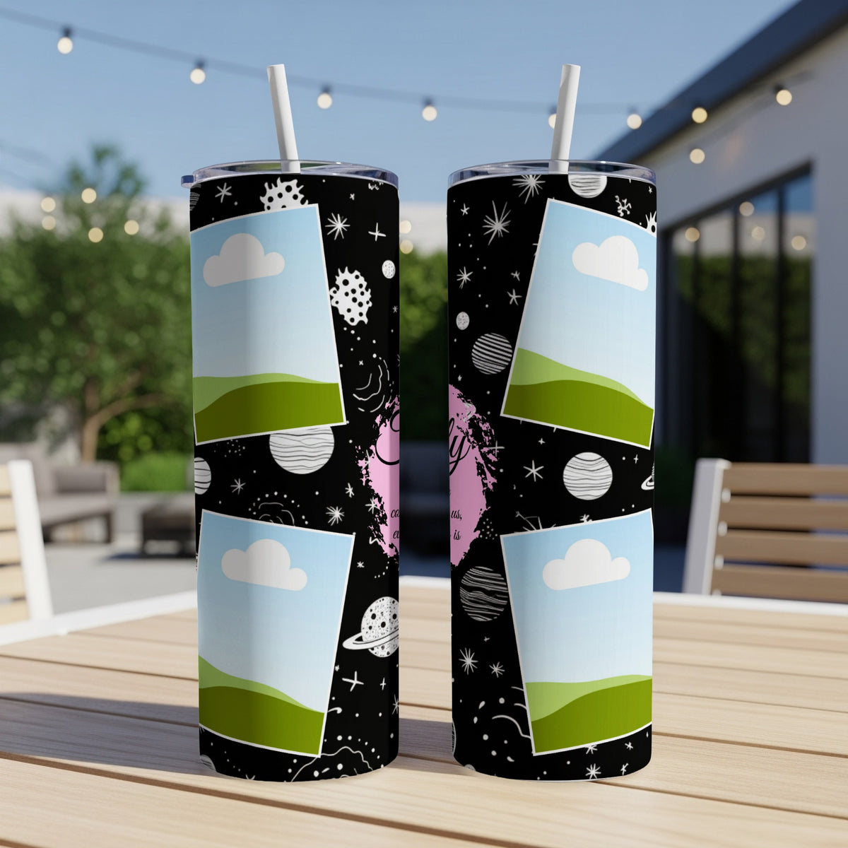 Two tumblers with a black space-themed pattern featuring planets, stars, and clouds.