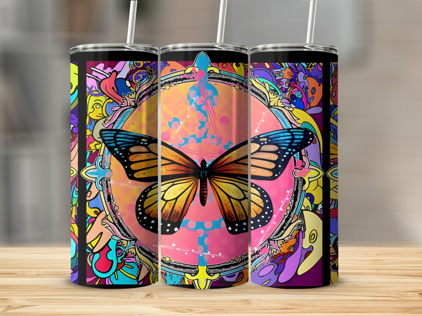 Three tumblers featuring a colorful butterfly and abstract patterns.