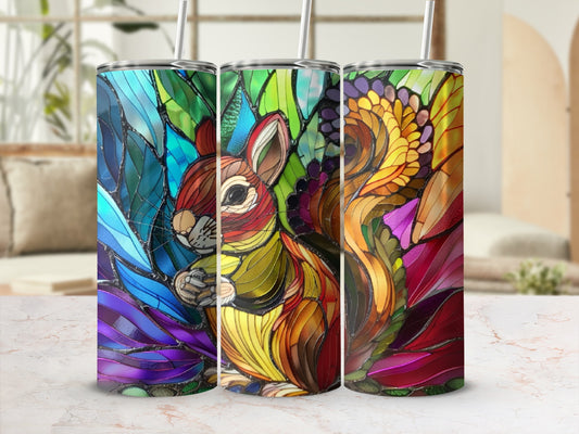 Stained glass tumbler featuring a squirrel surrounded by colorful, ornate foliage.