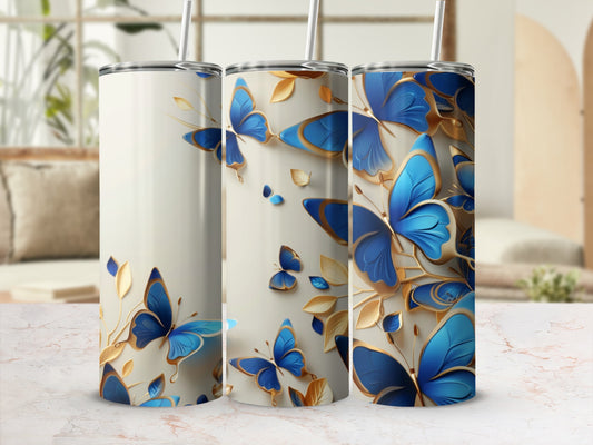 Three tumblers with blue and gold butterfly designs.
