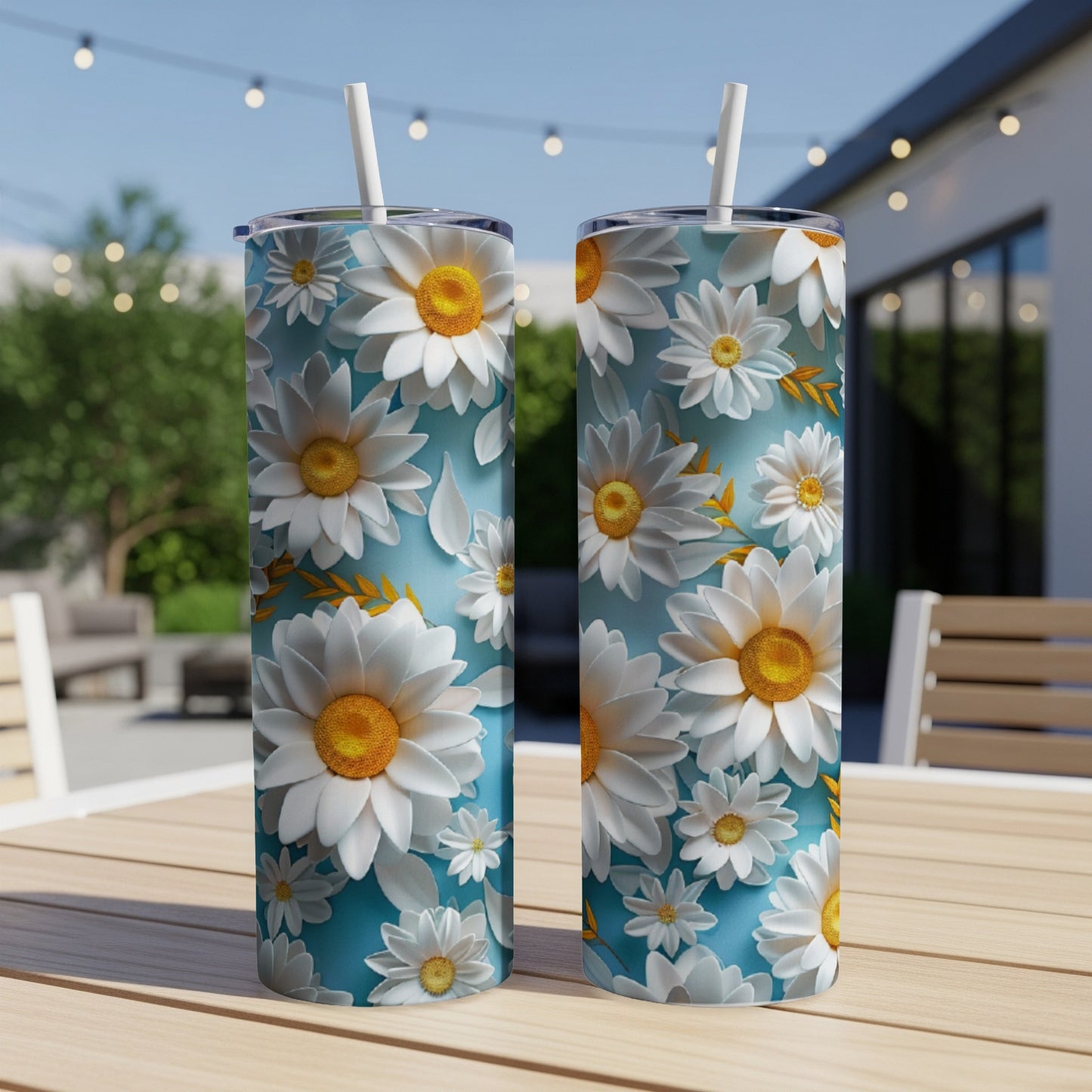 Two tumblers with white daisy floral pattern on a light blue background.