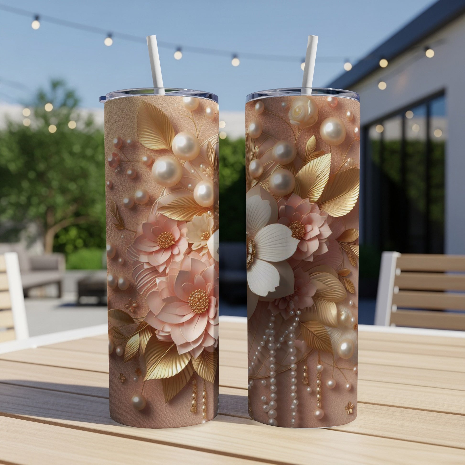 Two tall, slim tumblers with floral and pearl embellishments.