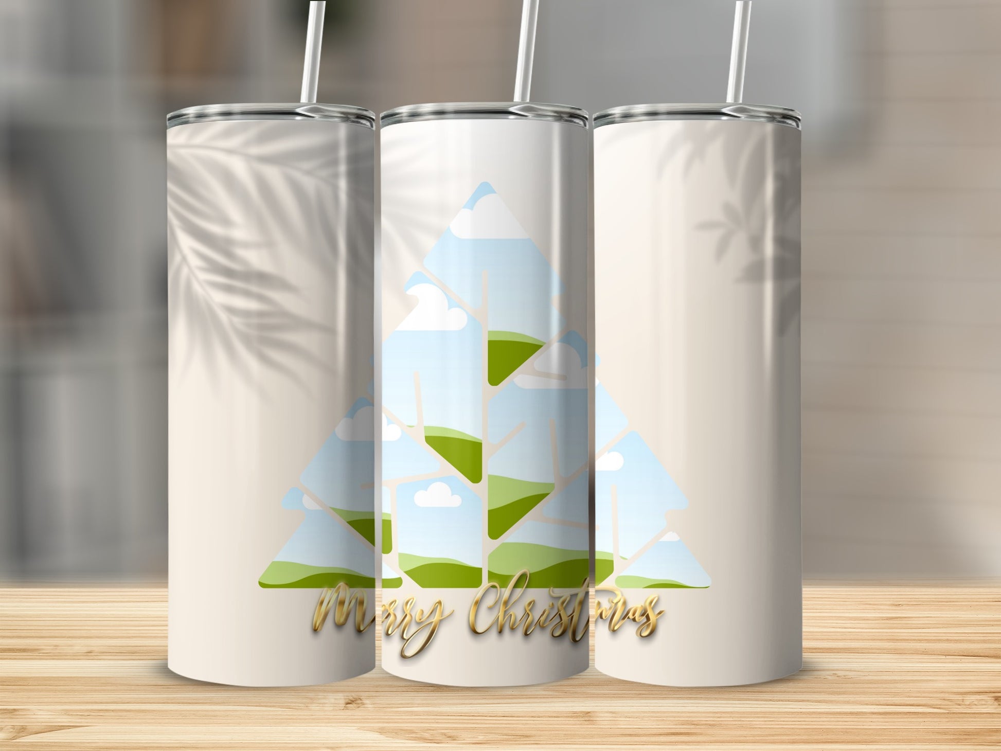 Three tumblers with a Christmas tree design and gold "Merry Christmas" text.