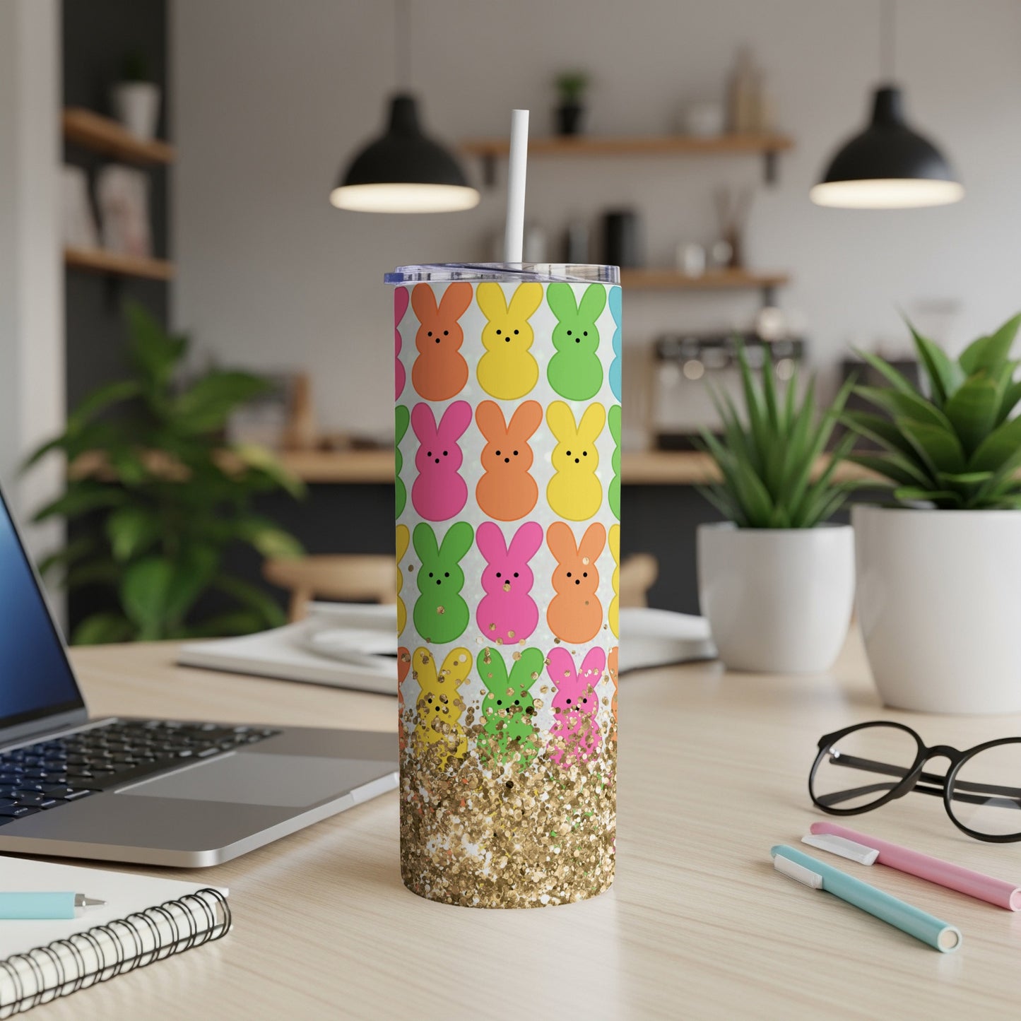 Colorful Peeps bunnies on a glitter tumbler with a straw.