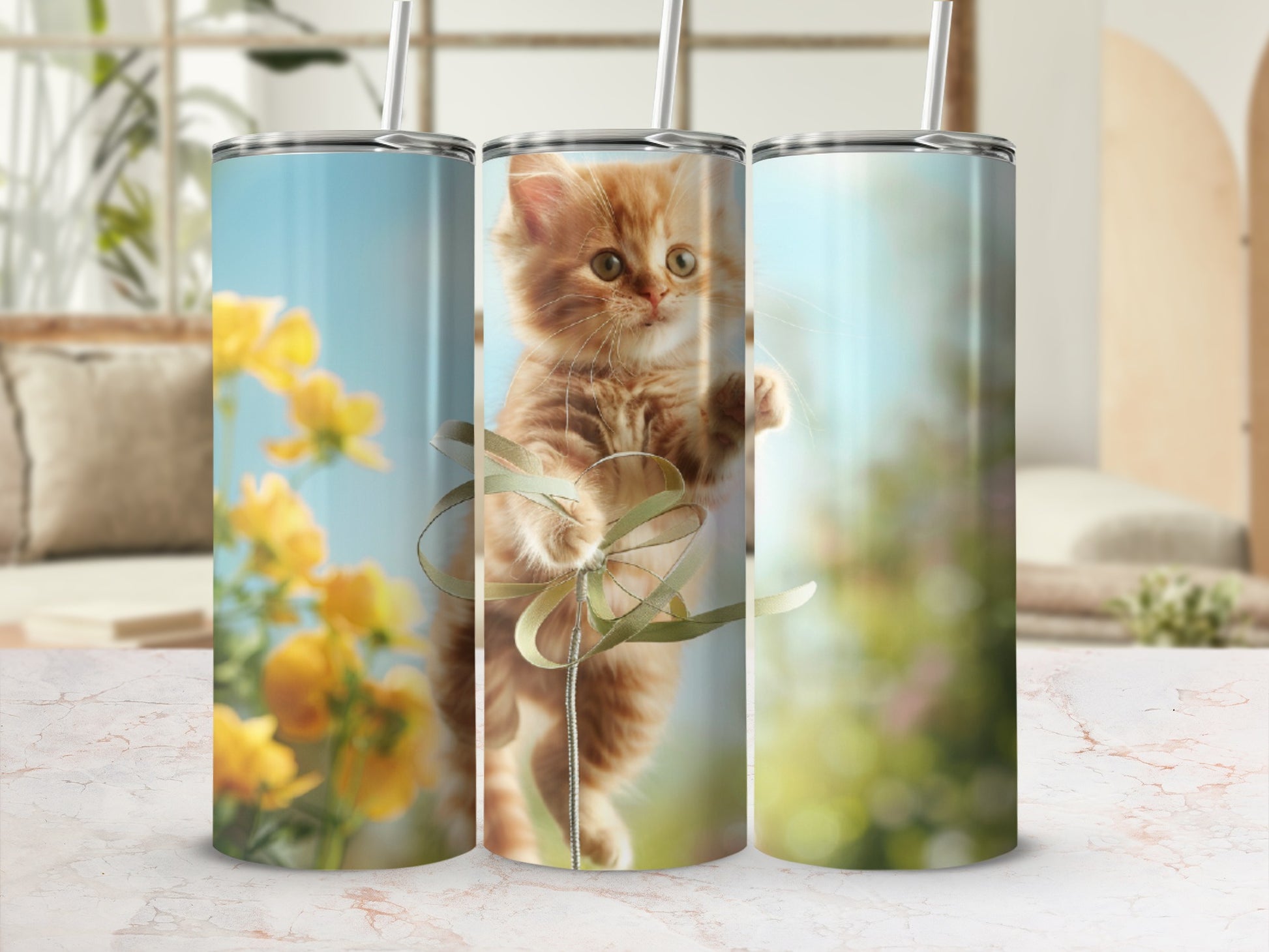 Orange kitten playing with ribbon, surrounded by blurred yellow flowers and foliage.