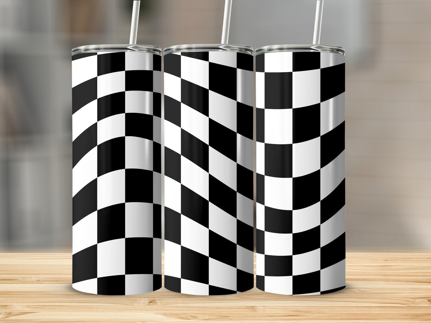 Three skinny tumblers with black and white checkered pattern.