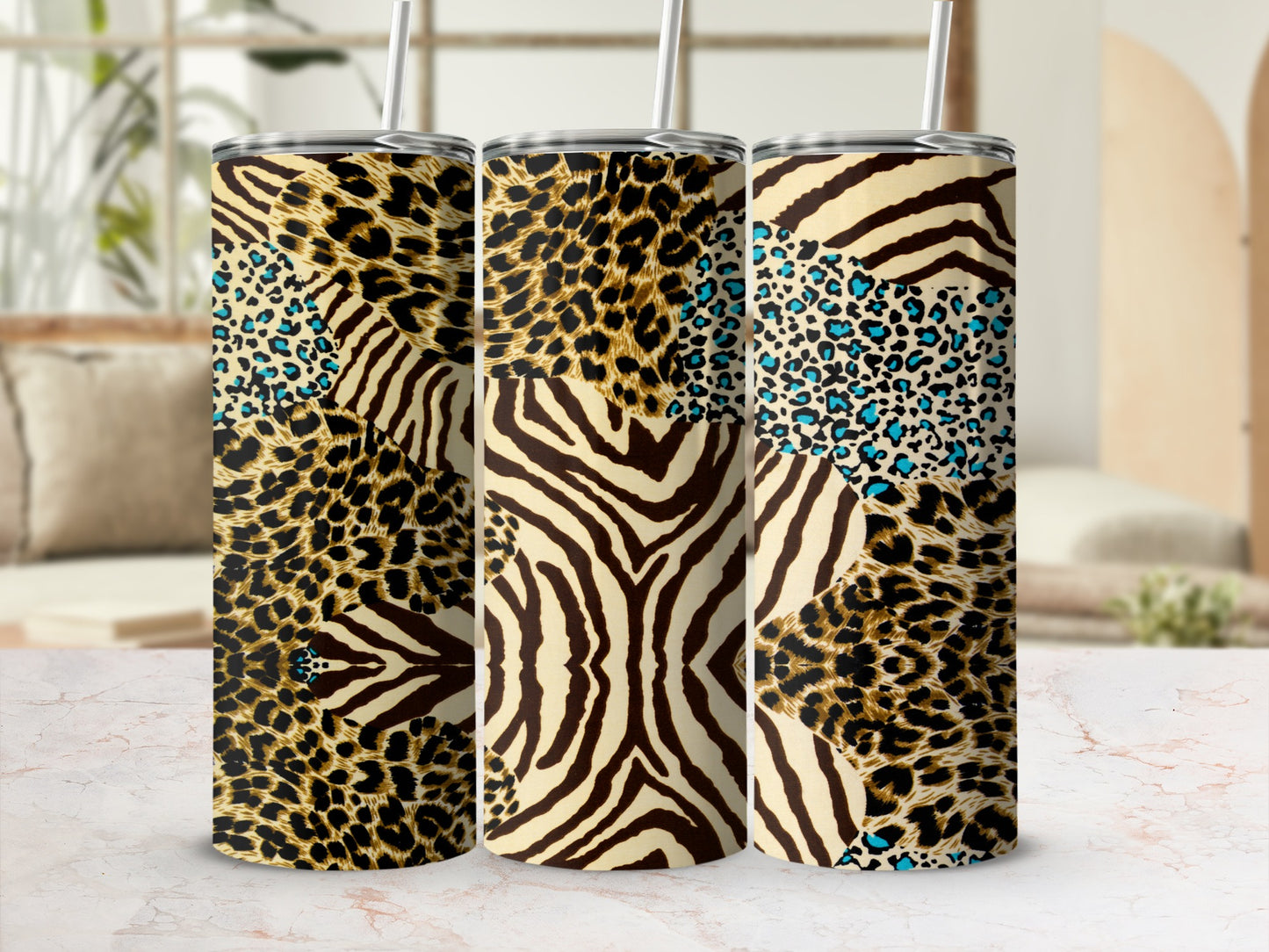 Three patterned tumblers with leopard, zebra, and cheetah prints.