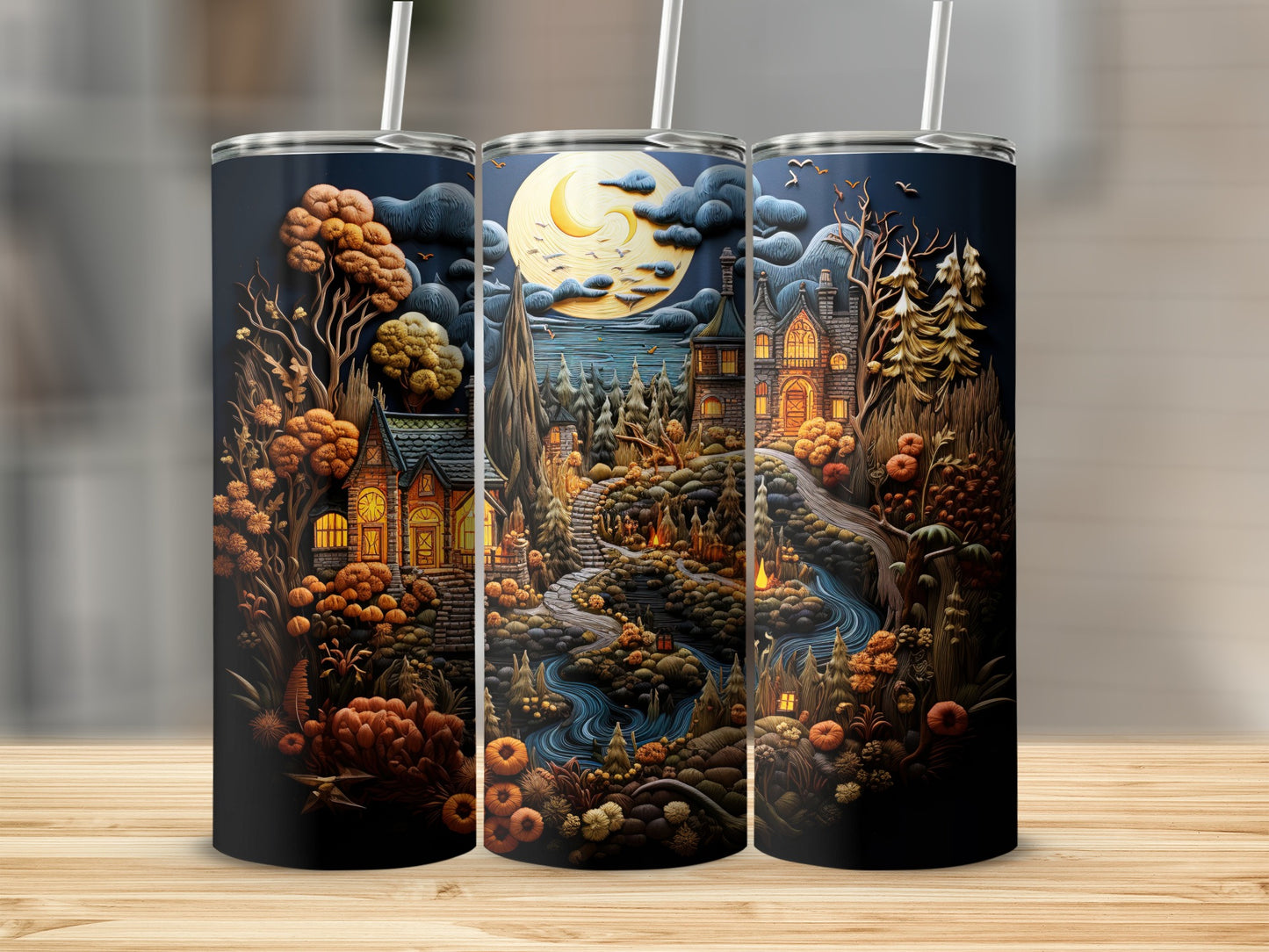 Halloween scene on tumblers with haunted houses, pumpkins, and a large moon.