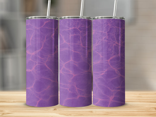 Three purple tumblers with a water ripple design on a wooden surface.