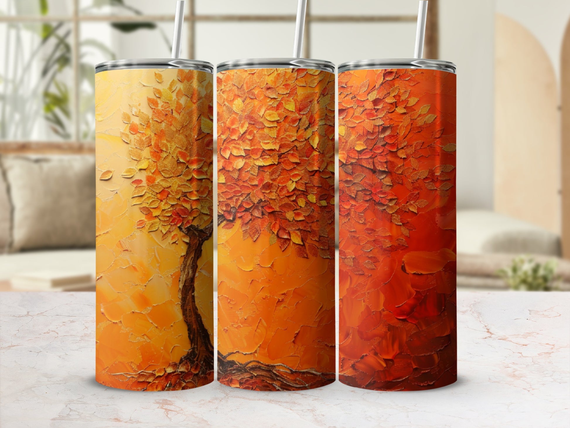 Tumbler with textured abstract autumn tree artwork in warm oranges and yellows.