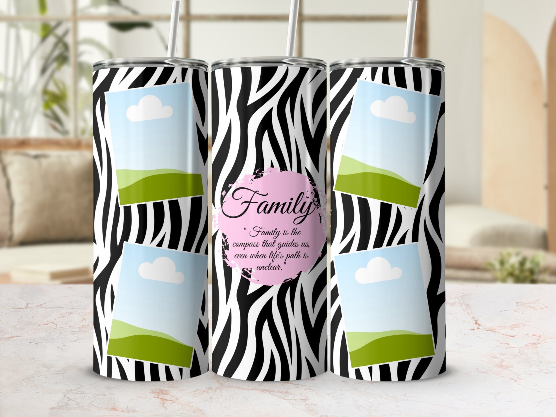 Zebra print tumbler with four photo frames and the quote "Family is the compass that guides us".