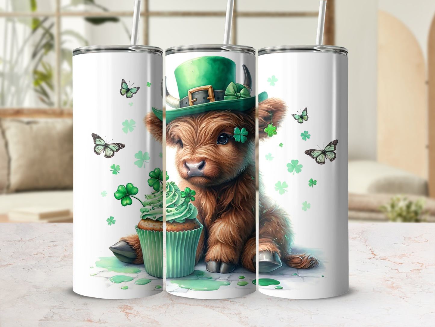 Cow wearing green hat, cupcake, and shamrocks on a tumbler.
