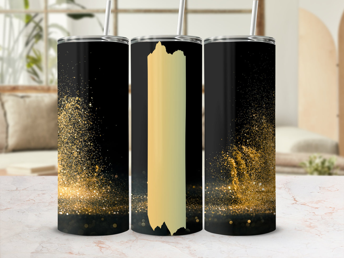 Black tumbler with gold glitter splatter and a vertical gold stripe.