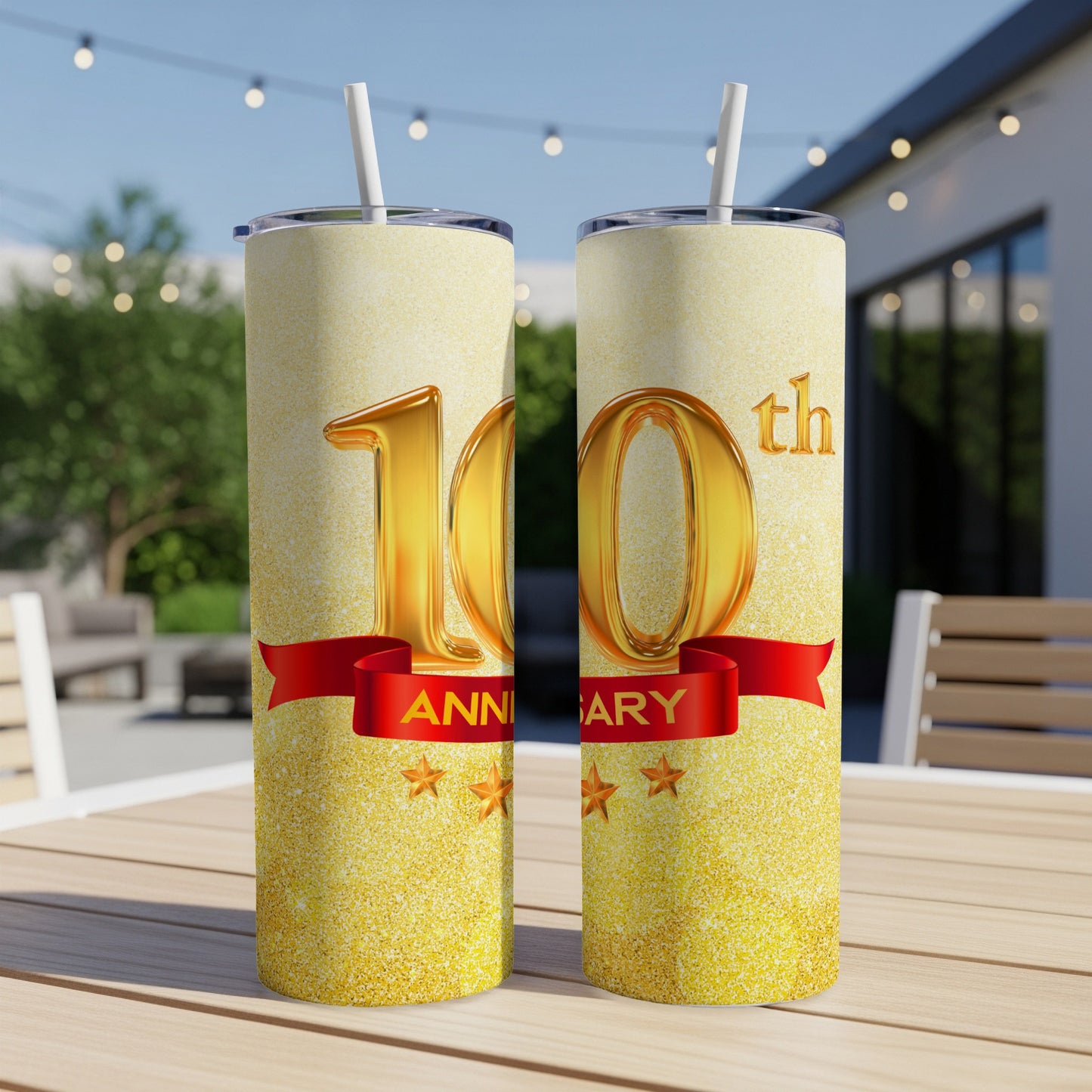 Two glittery tumblers with "10th Anniversary" text and red ribbon.