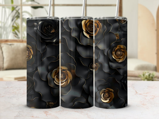 Black tumbler with gold floral accents and straw in a lifestyle setting.