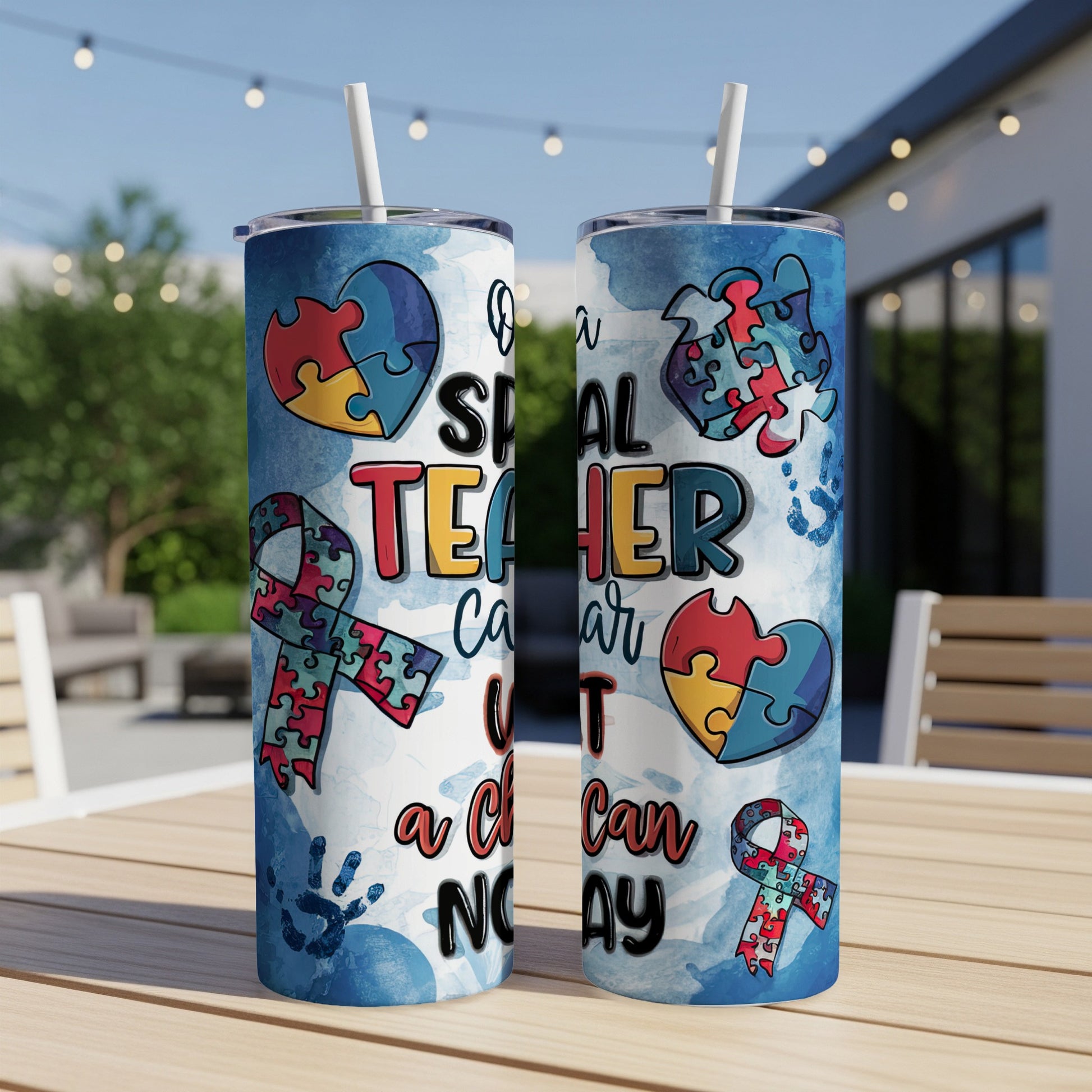 Two tumblers with a watercolor autism awareness ribbon and puzzle pieces.